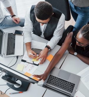 A group of multinational busy people working in the office. Height view